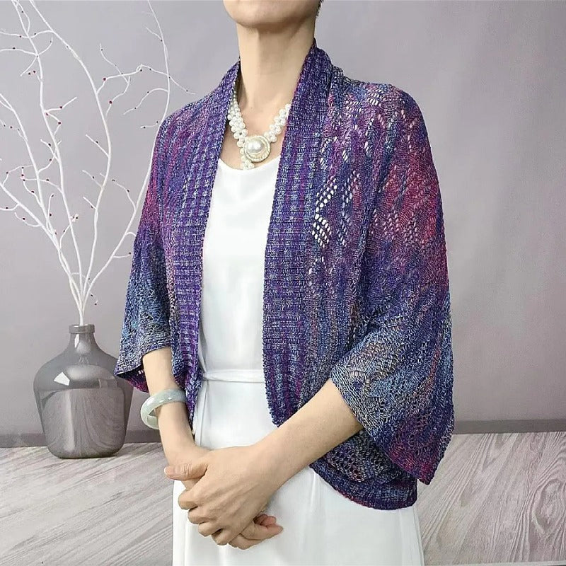 Modische langärmelige hohle Strickjacke