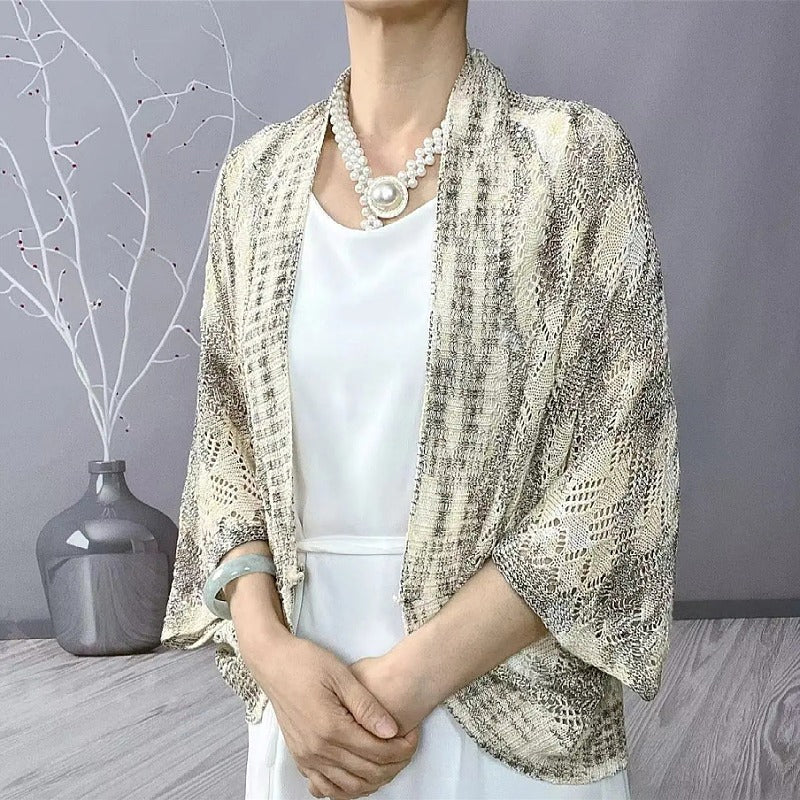 Modische langärmelige hohle Strickjacke